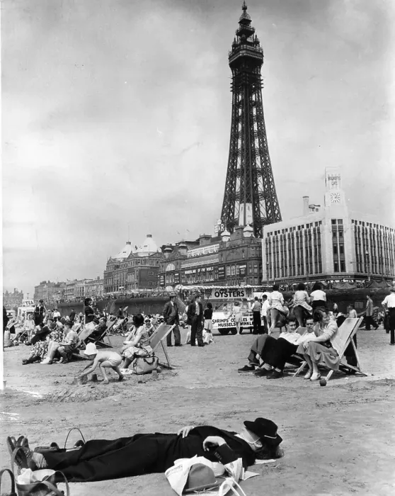 Framed Print : Beach Nap. 11th July 1953: A worn out holidaymaker taking a nap on the beach Framed Print : Beach Nap. 11th July 1953: A worn out holidaymaker taking a nap on the beach