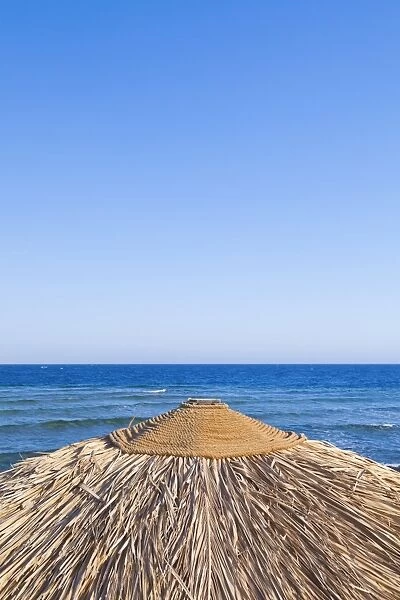 Beach parasol with sea view, Dahab, Egypt, Africa