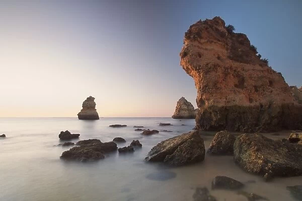 Beach with rocks at sunrise, Lagos, Portugal, Europe