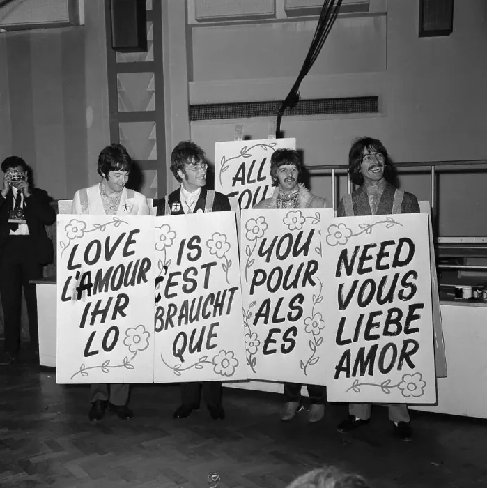 Framed Print : The Beatles Holding All You Need is Love Signs in Different Languages Framed Print : The Beatles Holding All You Need is Love Signs in Different Languages