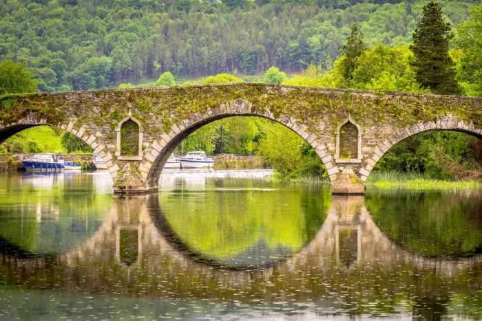 Framed Print : Beautiful Graiguenamanagh stone bridge with trees in the background on a rainy day, County Kilkenny, Ireland