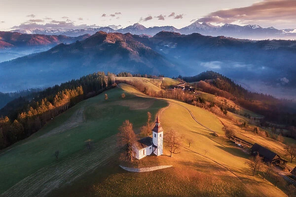 Beautiful Sunrise Landscape Of Saint Thomas Church and Julian Alps In Slovenia
