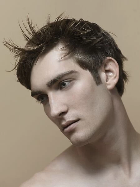 Beauty portrait of a young man with moving hair