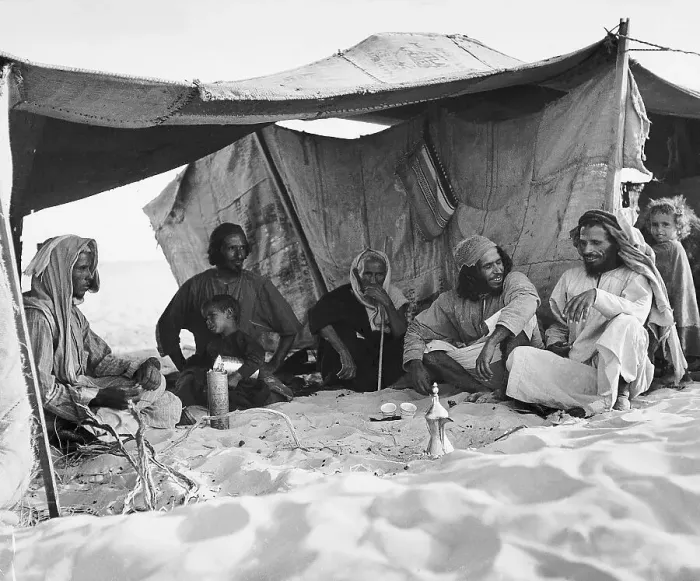 Framed Print : Bedouin Entertains Friends At Tent