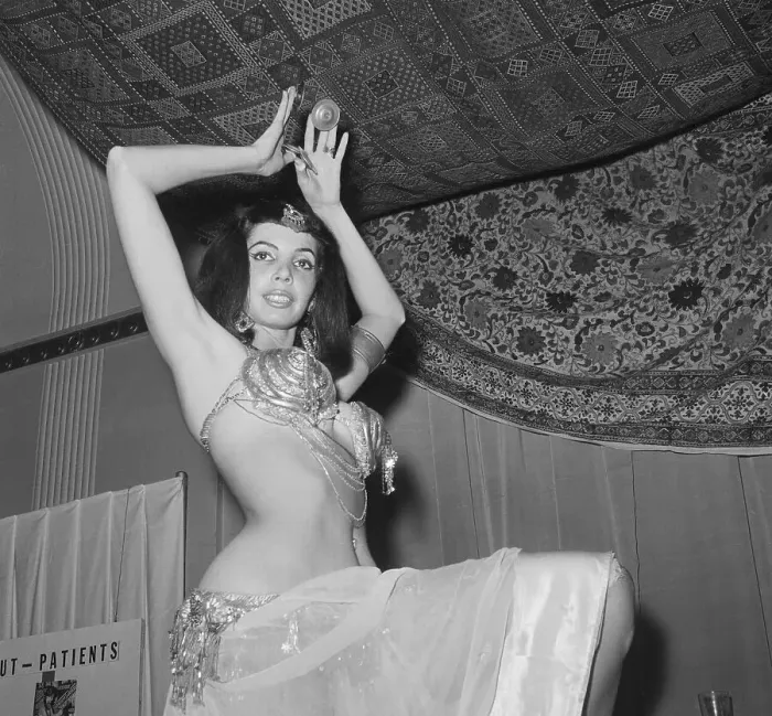 Framed Print : Belly Dancer Posing Underneath Oriental Rug Framed Print : Belly Dancer Posing Underneath Oriental Rug
