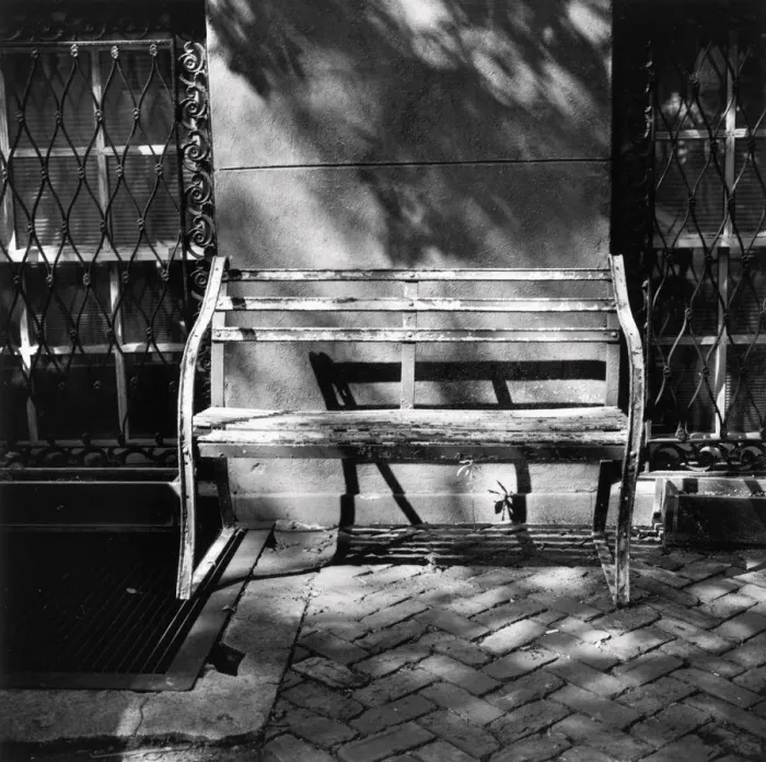 Framed Print : Bench with peeling paint against building wall Framed Print : Bench with peeling paint against building wall
