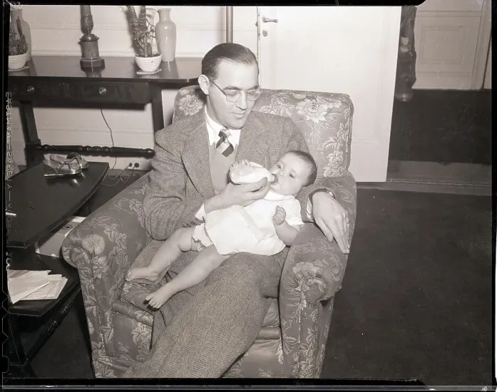 Framed Print : Benny Goodman Feeding Baby Framed Print : Benny Goodman Feeding Baby