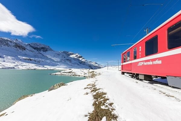 Bernina Express train at Lake Bianco Switzerland