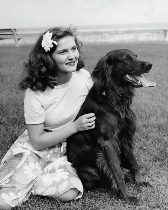Framed Print : Best Pals. A young woman sits with her Irish Setter dog in a park, US, circa 1960