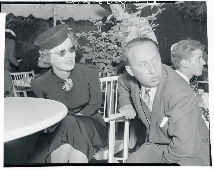 Framed Print : Bette Davis Chatting with Joe Pasternak Framed Print : Bette Davis Chatting with Joe Pasternak