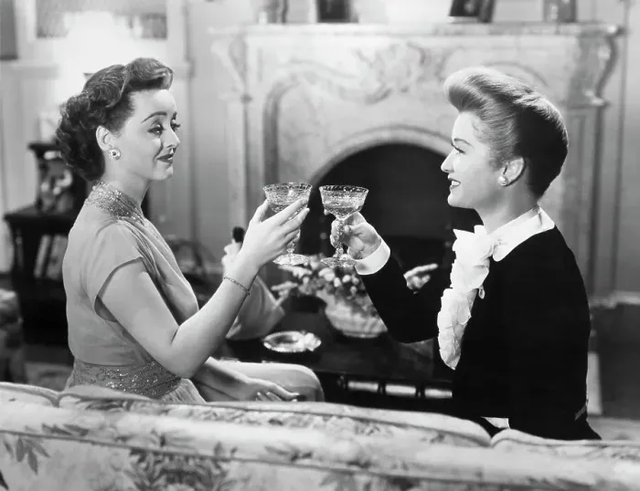Framed Print : Bette Davis And Miriam Hopkins Toasting Framed Print : Bette Davis And Miriam Hopkins Toasting