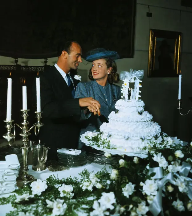 Framed Print : Betty Davis with New Husband Cutting Cake Framed Print : Betty Davis with New Husband Cutting Cake