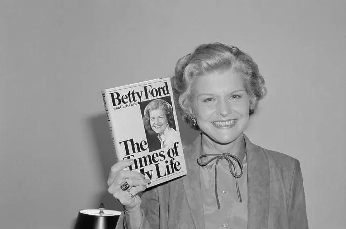 Framed Print : Betty Ford Holding up Her Book Framed Print : Betty Ford Holding up Her Book