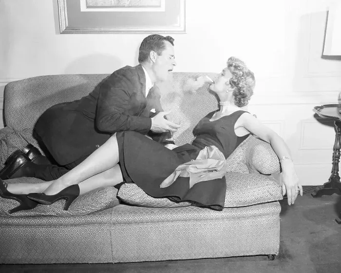 Framed Print : Betty Garrett Exhaling Smoke onto Her Husband Framed Print : Betty Garrett Exhaling Smoke onto Her Husband
