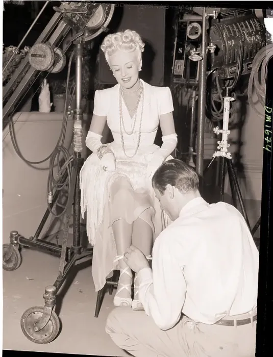 Framed Print : Betty Grable Having Her Shoe Laces Tied Framed Print : Betty Grable Having Her Shoe Laces Tied
