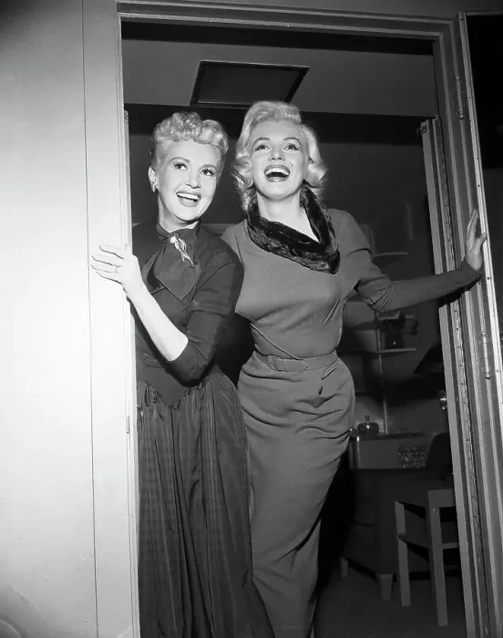 Framed Print : Betty Grable and Marilyn Monroe Standing in Doorway Together Framed Print : Betty Grable and Marilyn Monroe Standing in Doorway Together