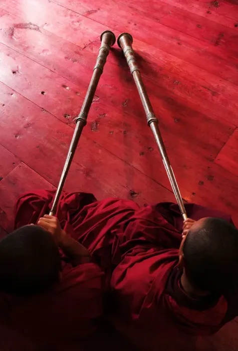 Framed Print : Bhutan, Jakar, two monks playing horns, elevated view Framed Print : Bhutan, Jakar, two monks playing horns, elevated view