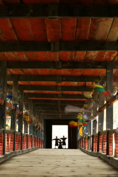 Framed Print : Bhutan, Paro, Paro Dzong, three boys (6-12) standing on covered bridge Framed Print : Bhutan, Paro, Paro Dzong, three boys (6-12) standing on covered bridge