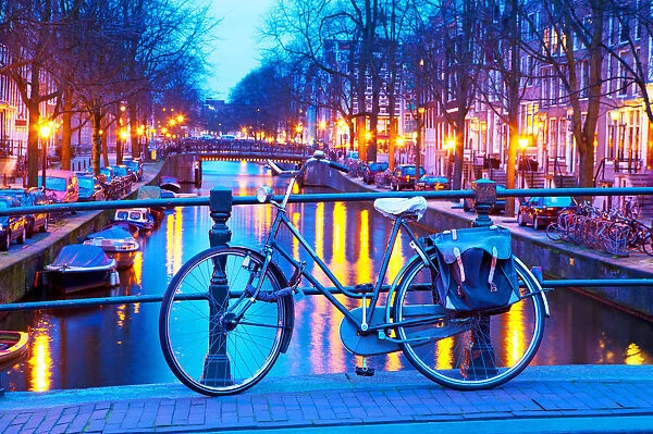 A bicycle on a bridge at dusk, Amsterdam