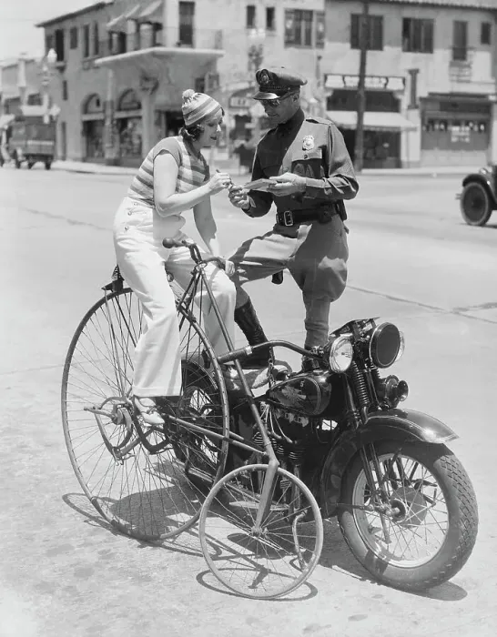 Framed Print : Bicyclist Receiving Ticket from Motorcycle Police Officer Framed Print : Bicyclist Receiving Ticket from Motorcycle Police Officer