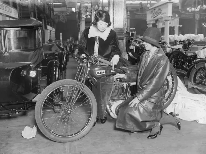 Framed Print : Bike Show. October 1928: Billy Painter examining a BSA motorcycle at the Framed Print : Bike Show. October 1928: Billy Painter examining a BSA motorcycle at the