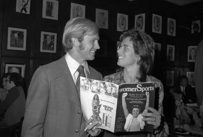 Framed Print : Billie Jean King and Husband Displaying Their New Magazine Framed Print : Billie Jean King and Husband Displaying Their New Magazine