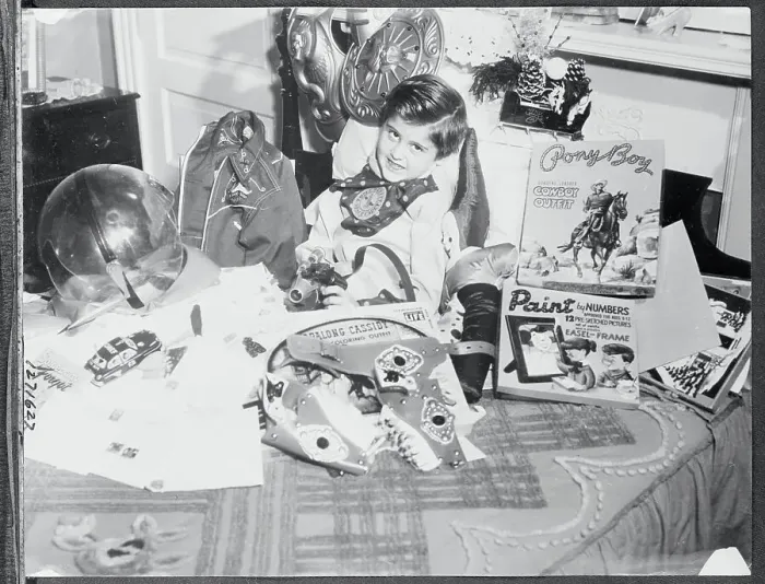 Framed Print : Billy Bente Sitting Surrounded by Toys Framed Print : Billy Bente Sitting Surrounded by Toys