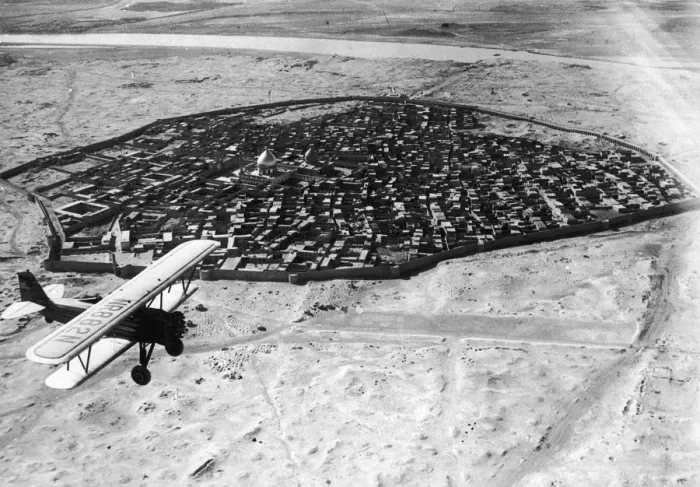 Framed Print : Biplane over Baghdad, Iraq Framed Print : Biplane over Baghdad, Iraq