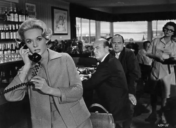 Framed Print : The Birds. American actress Tippi Hedren makes a telephone call in a scene Framed Print : The Birds. American actress Tippi Hedren makes a telephone call in a scene