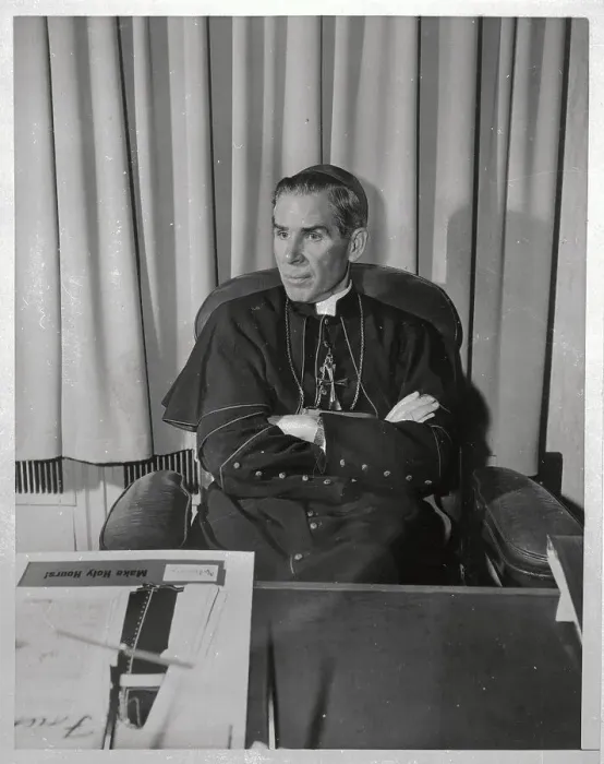 : Bishop Fulton Sheen Speaking from his Desk : Bishop Fulton Sheen Speaking from his Desk