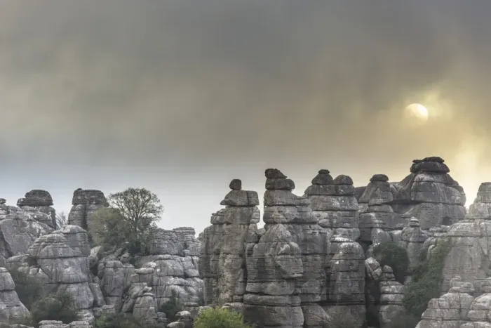 Framed Print : Bizarre limestone rock formations with the sun and fog, El Torcal Nature Reserve, Antequera, Andalusia, Spain Framed Print : Bizarre limestone rock formations with the sun and fog, El Torcal Nature Reserve, Antequera, Andalusia, Spain