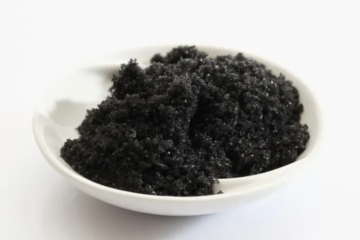 Framed Print : Black Hawaiian sea salt in a small porcelain bowl