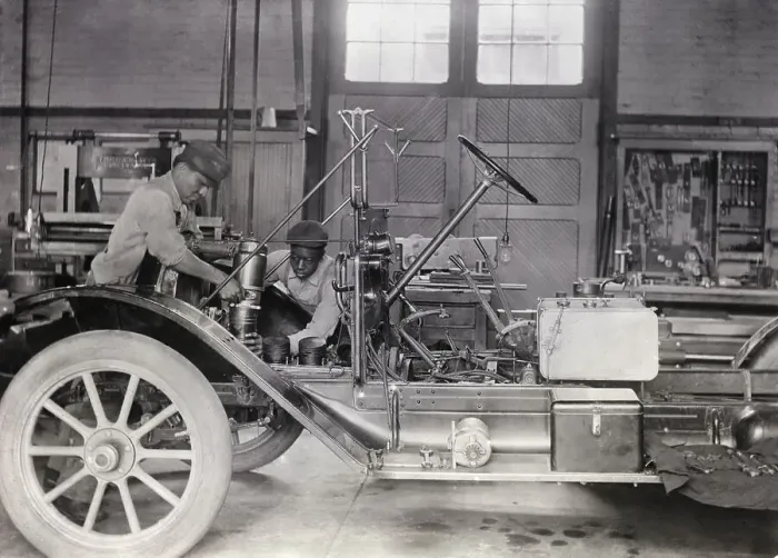 Framed Print : Black Mechanics Working On Car In Garage Framed Print : Black Mechanics Working On Car In Garage