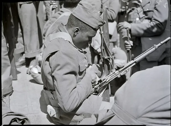 Framed Print : Black Soldier Cleaning Rifle Framed Print : Black Soldier Cleaning Rifle
