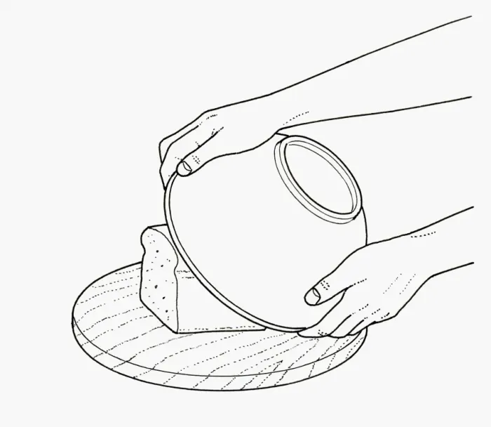 Framed Print : Black and white illustration of covering loaf on chopping board with bowl to retain freshness Framed Print : Black and white illustration of covering loaf on chopping board with bowl to retain freshness