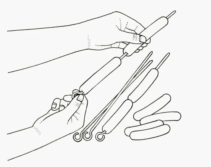 Framed Print : Black and white illustration of putting hot dog sausages on skewer Framed Print : Black and white illustration of putting hot dog sausages on skewer