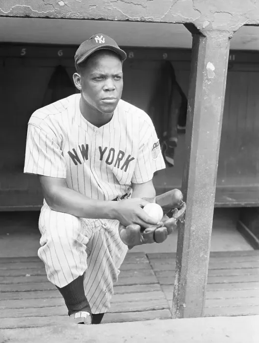 Framed Print : Black Yankees Pitcher Standing in Dugout