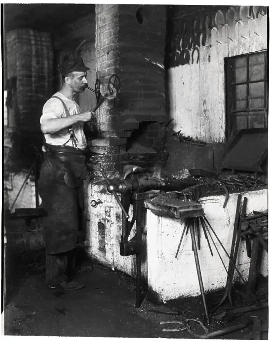 Framed Print : Blacksmith Lights Cigar W / Hot Horseshoe Framed Print : Blacksmith Lights Cigar W / Hot Horseshoe