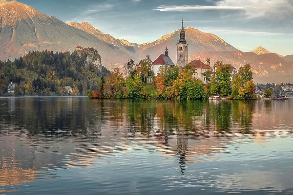 Bled Island and Bled Castle surrounded with Julian Alps Reflection on Lake Bled