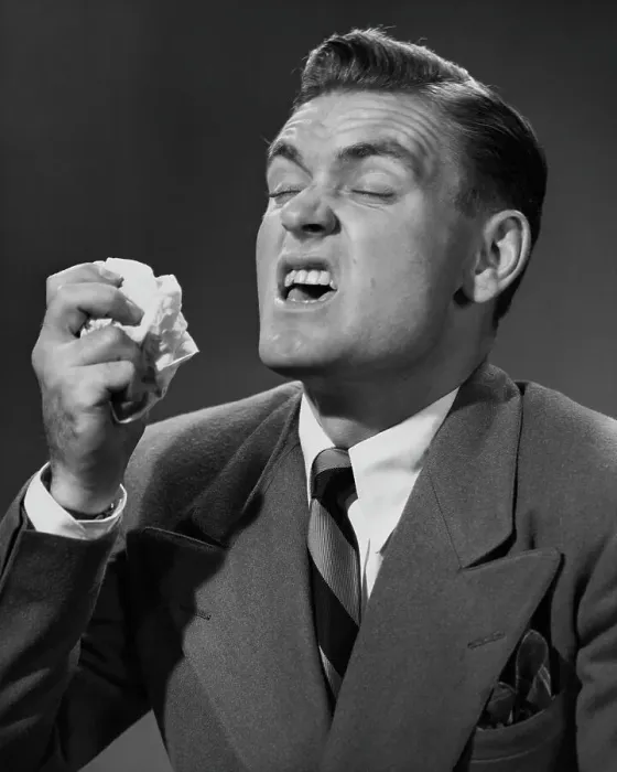 Framed Print : Bless You. A smartly-dressed man in the middle of a sneeze, circa 1955 Framed Print : Bless You. A smartly-dressed man in the middle of a sneeze, circa 1955