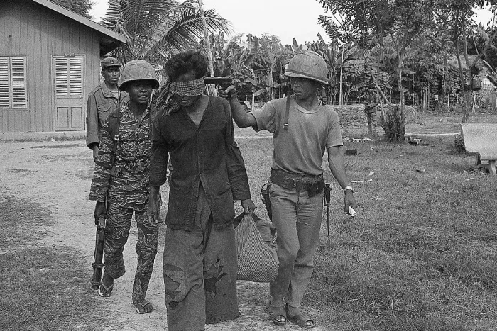 Framed Print : Blindfolded Suspect with Gun to Head
