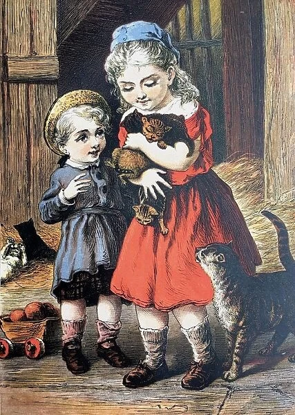 Blond girl in barn holding the cats babies in her arms