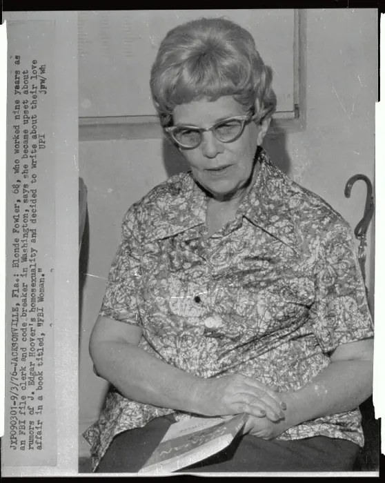 Framed Print : Blonde Fowler Sitting with Booklet in her Lap