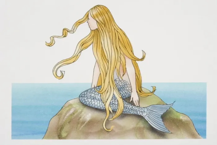 Framed Print : Blonde mermaid sitting on sea rock, side view Framed Print : Blonde mermaid sitting on sea rock, side view