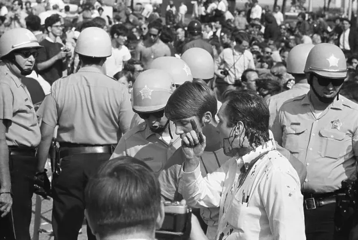 Framed Print : Bloody Protester Faces Off W / Policeman Framed Print : Bloody Protester Faces Off W / Policeman