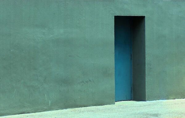 Blue Door. A color photograph of a door to a commercial building in downtown Portland