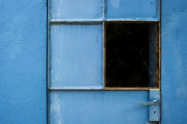 Blue-painted door with a window, Spain