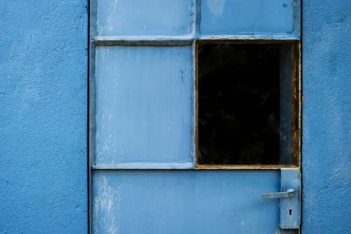 Framed Print : Blue-painted door with a window, Spain Framed Print : Blue-painted door with a window, Spain