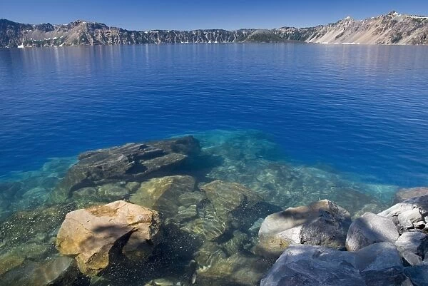 The blue water of crater lake from the shore