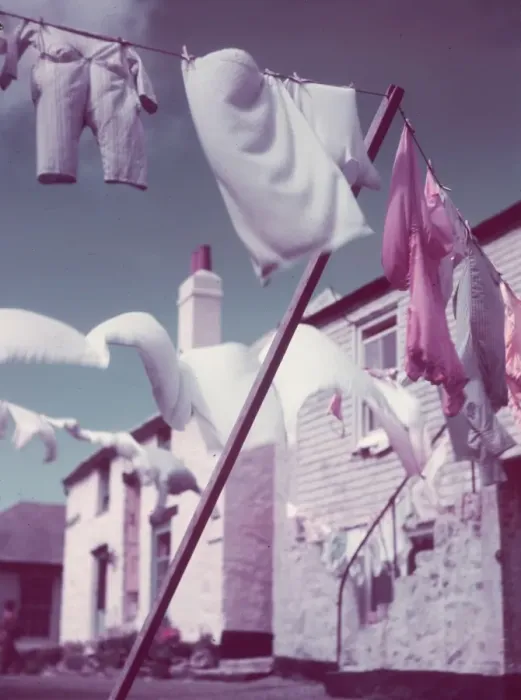 Framed Print : Blustery. Washing lines strung across a village street Framed Print : Blustery. Washing lines strung across a village street